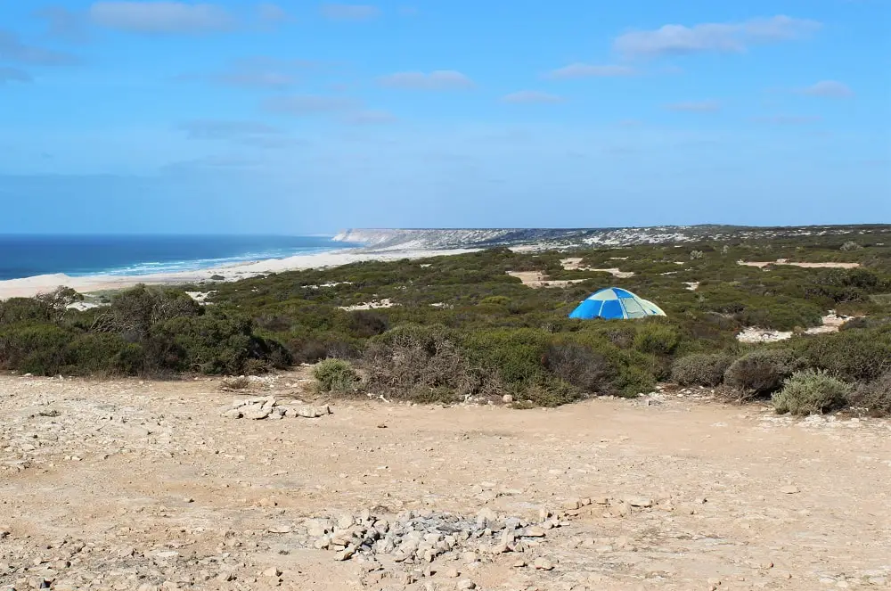 A lone tent pitched at Bunda Cliffs on the Nullarbor Plain on blogger, Lisa Bull's, road trip from Perth to Adelaide.