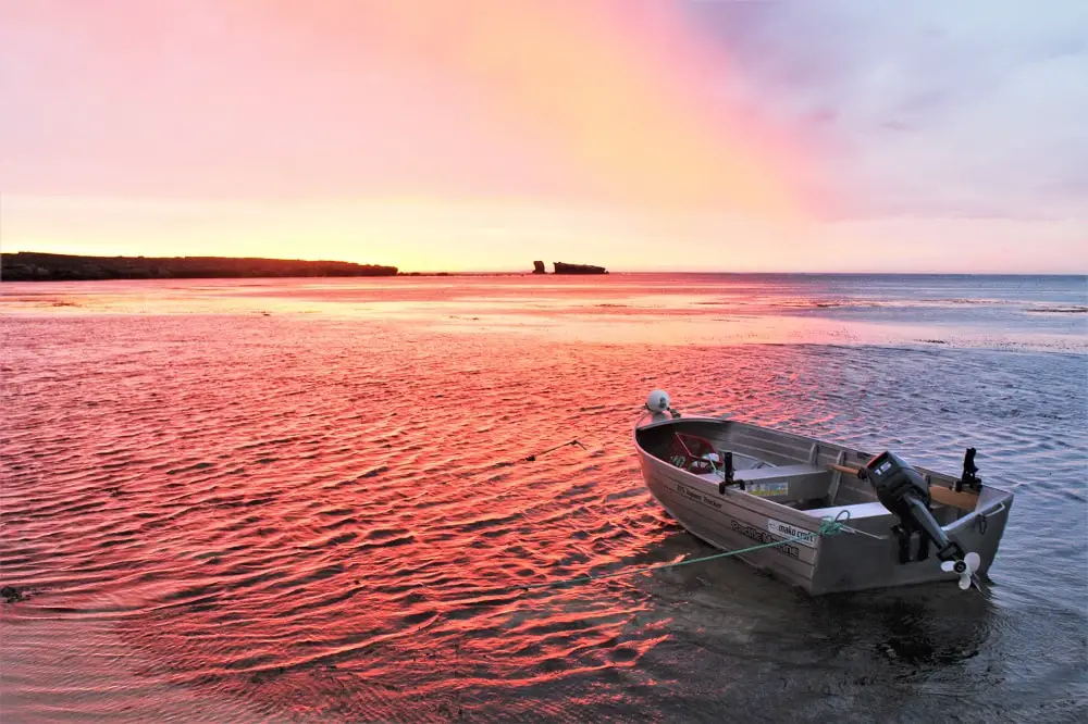 A stunning bright red sunset on the water in Elliston, SA.