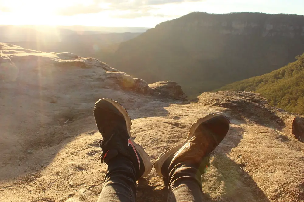 Blogger, Lisa Bull, watching the sunset at a lookout in the Blue Mountains.