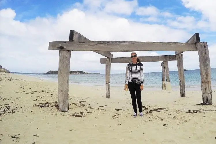 Lisa Bull, travel blogger, at Hamelin Bay jetty ruins in Western Australia.
