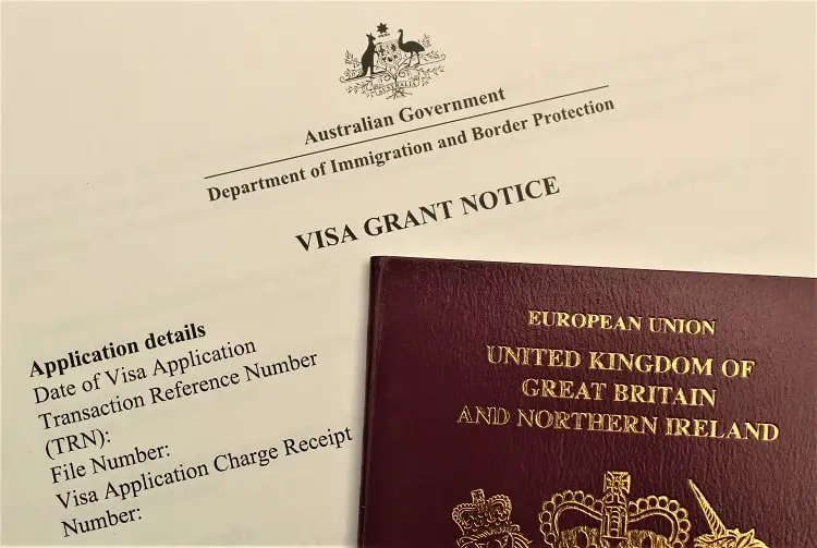 An image of a UK passport and Australian visa grant letter.