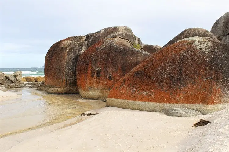 Orange granite boulders at Squeaky Beach, Australia, an iconic landmark in Wilsons Promontory National Park.
