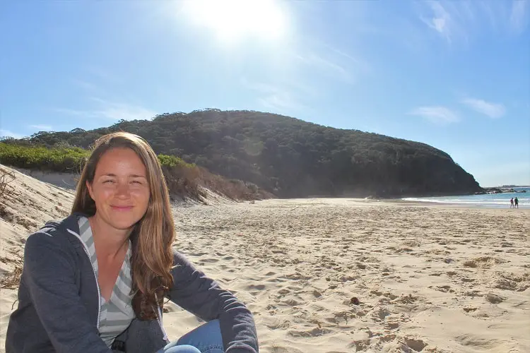 Travel blogger on Elizabeth Beach in NSW Australia.