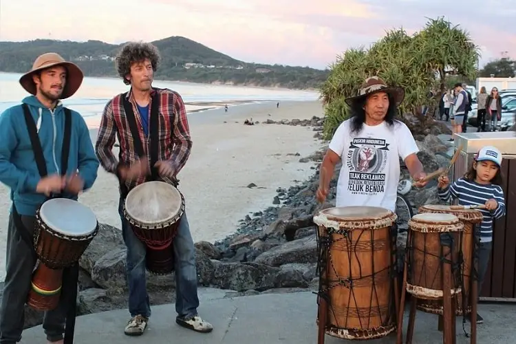 Byron Bay drumming circle at sunset.