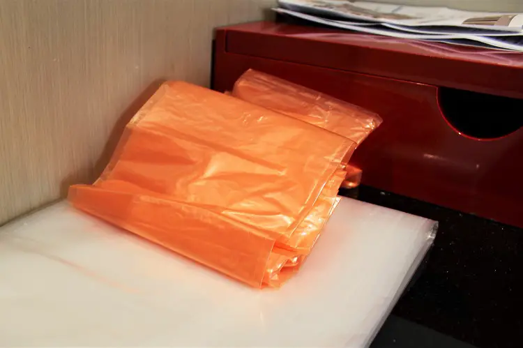 Bin liners for rubbish in a hotel quarantine room.