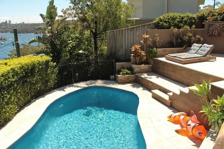 A swimming pool and harbour view at a UK woman's luxury house sit in Sydney, Australia.