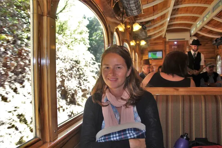 Female backpacker on the rack and gorge West Coast wilderness steam train ride in Queenstown, Tasmania, which is a top item for your Tasmania drive itinerary.