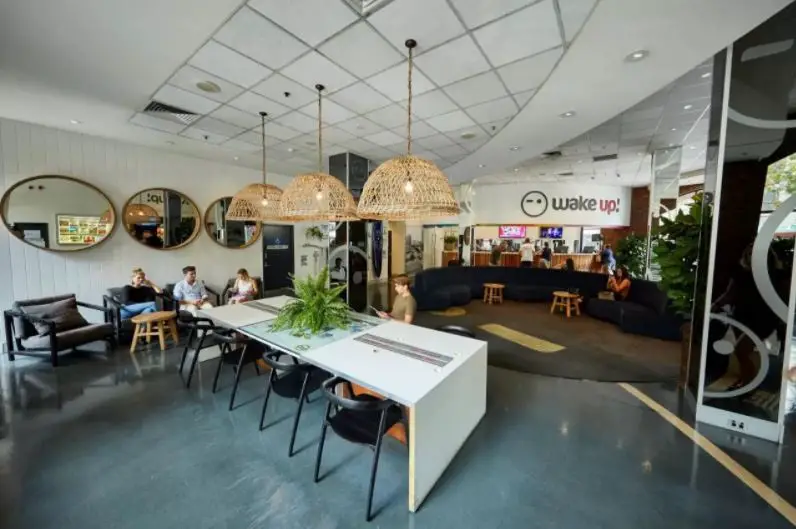 Modern reception area at Wake Up hostel in Sydney CBD.
