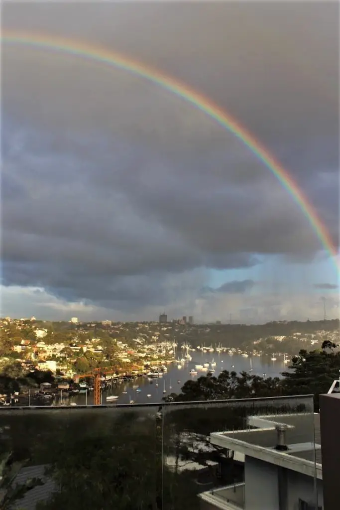 Amazing rainbow and grey sky over Mosman in Sydney, one of the wettest cities in Australia.