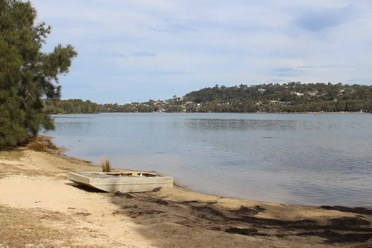 The shores of Narrabeen Lagoon, a top place to go by car in Sydney.