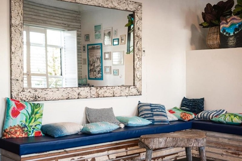 Modern, funky bench with colourful cushions at Wake Up! Bondi Beach hostel in Sydney, Australia.