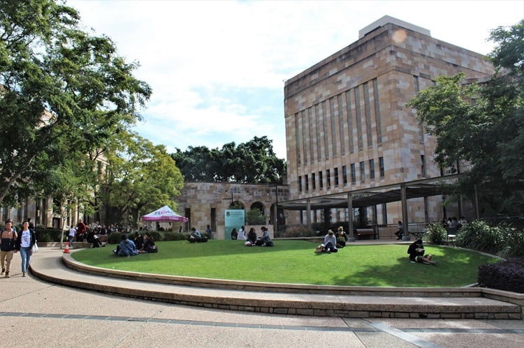 Students on the grass at The University of Queensland in Brisbane.